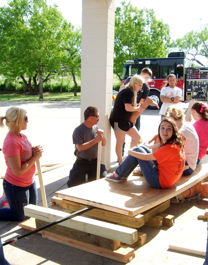 Photo of teens performing training duties